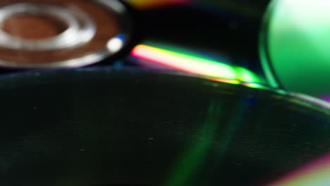 cd disks on black background close-up. old vintage disks for dvd player or computer. music recorder, playing retro computer games.