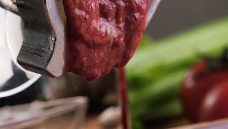 red beet smoothie being processed in a blender