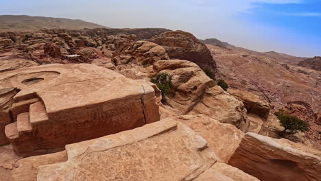 remnants of the ancient city locating in the desert. climbing to the stairs of the house ruins revealing view on the mighty canyons. jordan, west asia.