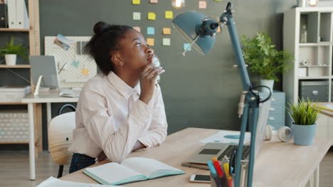 young woman in office thinking