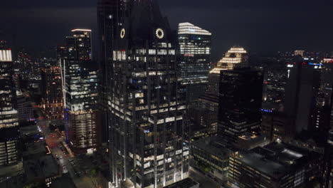 nighttime cityscape with illuminated skyscrapers