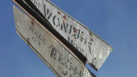 Medium-Shot-Of-The-Corroded-Blades-Of-A-Vintage-Weathervane-Lightly-Moving-In-A-Small-Breeze