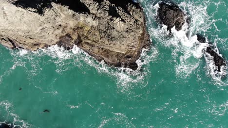 Drone-flies-over-sea-stacks-and-islets-near-coast