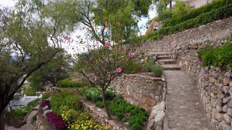 stone walls with walking path and stairs in a landscaped garden at the apolonia park in cajamarca, peru