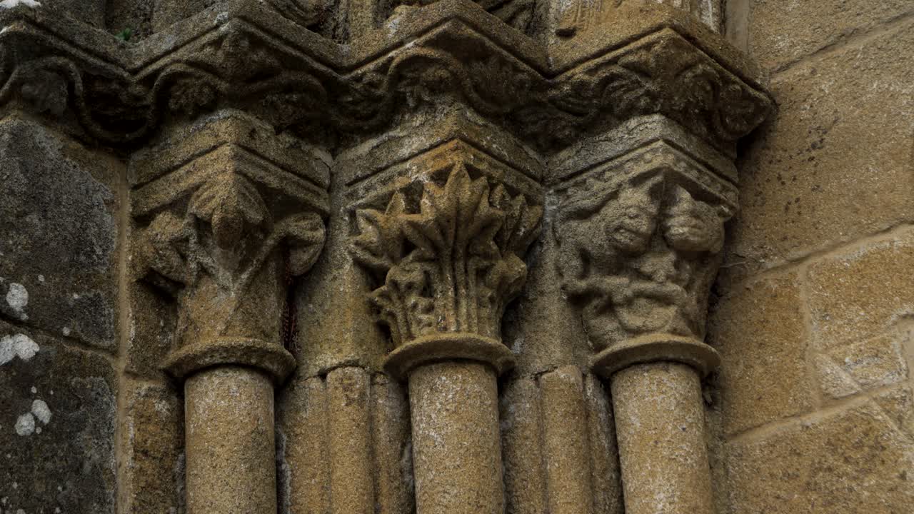 Column details of Santiago de Gustei church, showcasing intricate stonework in Galicia, Spain