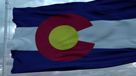 flag of colorado waving in the wind against deep beautiful clouds sky