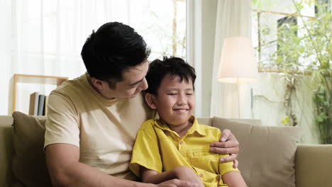 Asian-man-and-boy-in-the-living-room