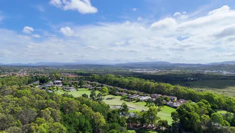 aerial view of suburban golf estate and forest