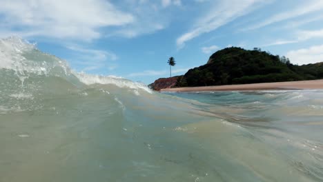 Punto-De-Vista-Desde-El-Interior-Del-Agua-Mientras-Pasa-Una-Ola-En-La-Hermosa-Playa-Tropical-De-Tabatinga-En-El-Norte-De-Brasil-Cerca-De-Joao-Pessoa