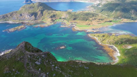 lofoten islands panorama viewpoint on top of a mountain in norway, scandinavia - aerial tilting up