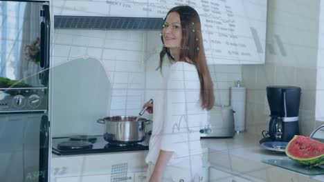 animación de gráficos, tableros de negociación, mujer caucásica cocinando comida, sonriendo mientras mira a la cámara