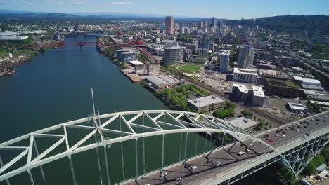 Aerial-slowly-pushing-over-Portland,-Oregon's-Fremont-Bridge-with-a-view-of-the-city-skyline