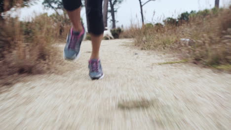 woman-running-trail-close-up-shoes-steadicam-shot