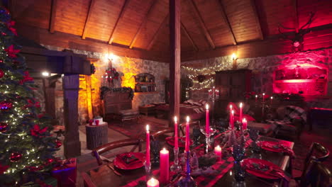 cozy stone house with wooden roof and beams. beautiful room with old furniture decorated for christmas celebrations.