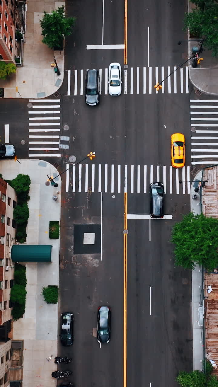 Descending above one of the crossroads in New York. Drone footage along the orange brick multistoried buildings.