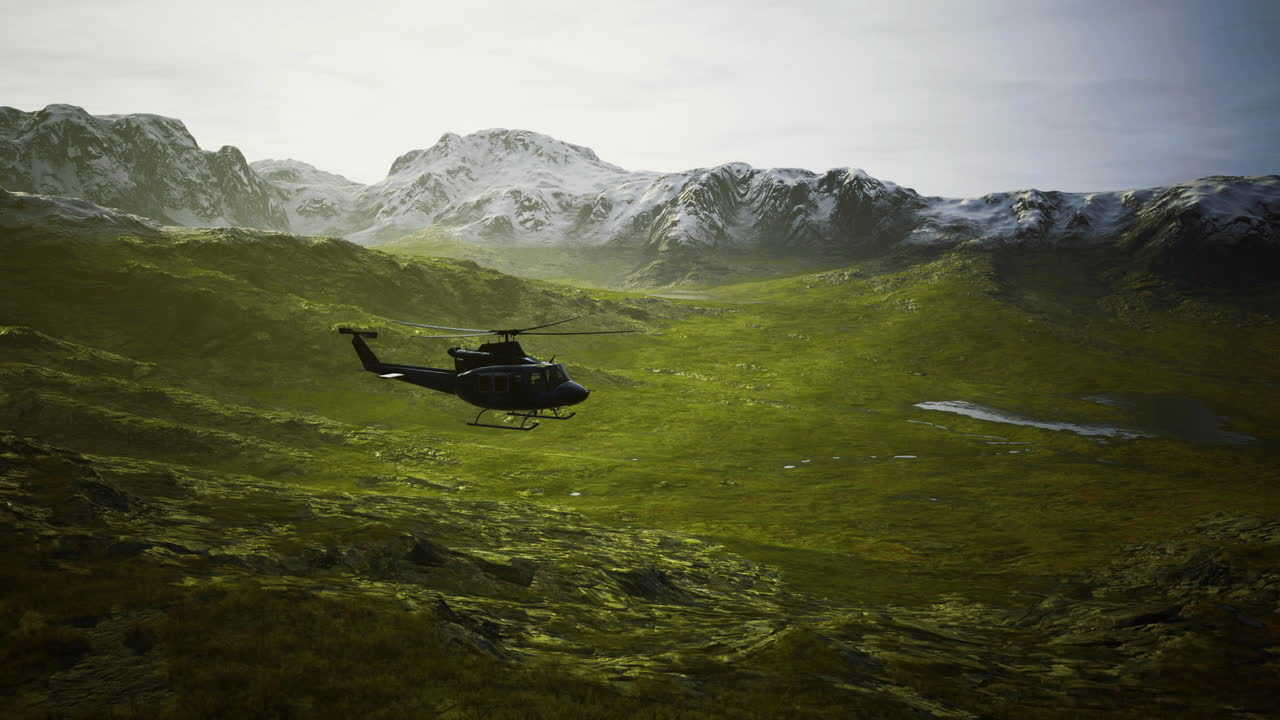 Helicopter flying over a lush green valley with snow capped mountains