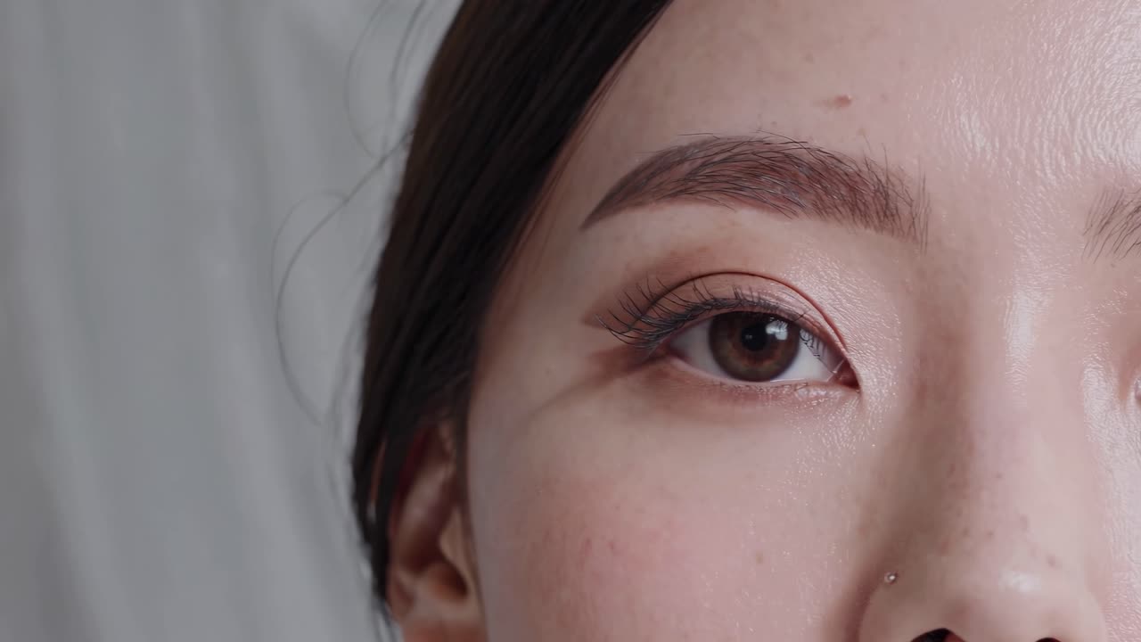 Close-up video of a woman's eyes, capturing natural beauty with a soft focus