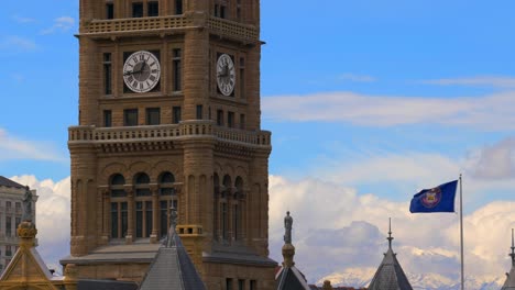 a close up of the clock on top of the old salt lake city courthouse on beautiful spring afternoon