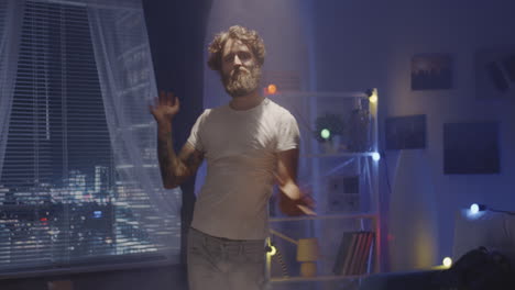 man dancing in a night room