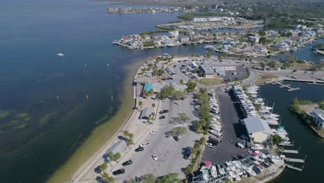 4k drone video of beach park, marina, and waterfront homes in hudson beach on the gulf of mexico in florida