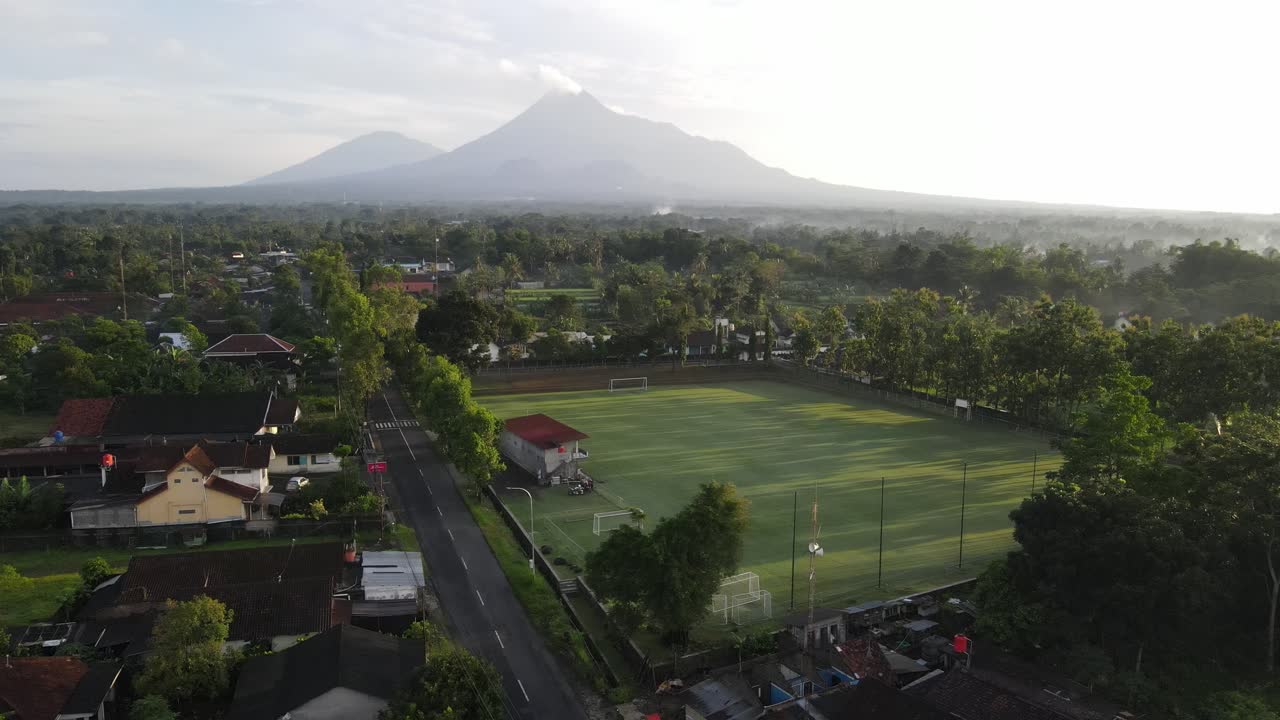Aerial footage using drones. Purwobinangun Sports or soccer field in ...