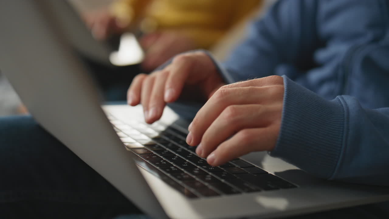 Freelancer hands typing keyboard holding laptop closeup. Unknown man working