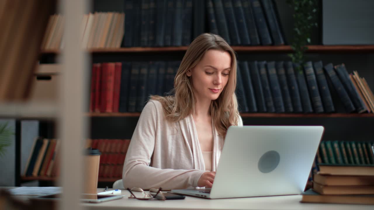 Modern business woman working at home public library chatting use laptop at workplace desk