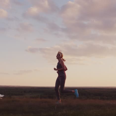 Athletic-Middle-Aged-Woman-Runs-At-Sunset-2