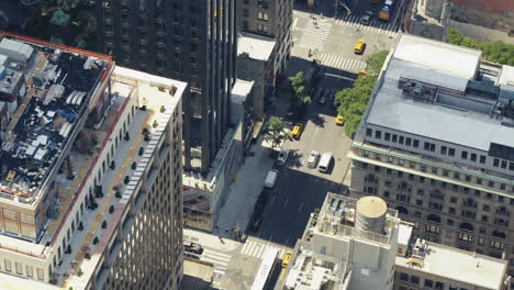 top view of an urban area of manhattan on a sunny day with a lot of yellow taxis in the streets, static shot