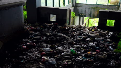 Heap-Of-Plastic-Waste-At-Abandoned-Hotel-Pondok-Indah-Bedugul-In-Bali,-Indonesia