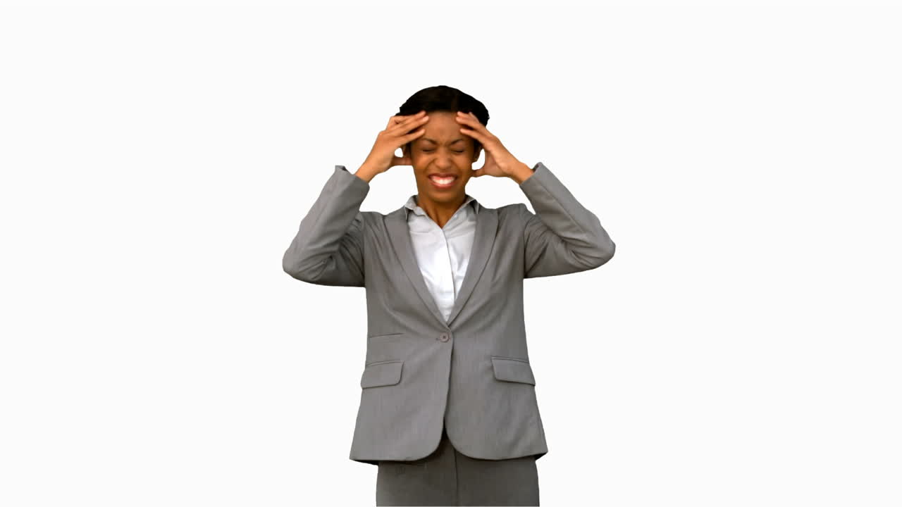 Furious businesswoman holding her head on white screen