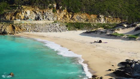 pollution at binh hung beach with turquoise sea water breaking on shore