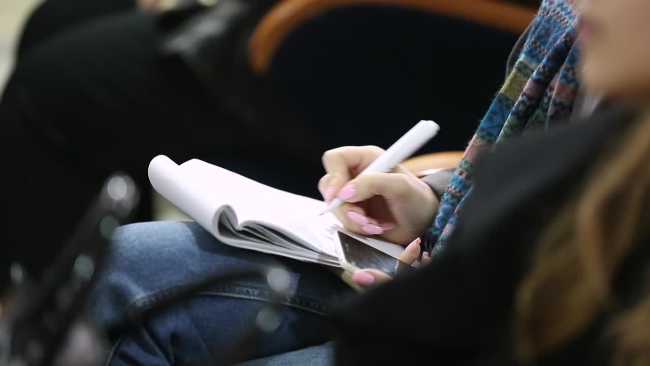 Working At A Business Conference. Conference meeting, hands, pen, notebooks and writing