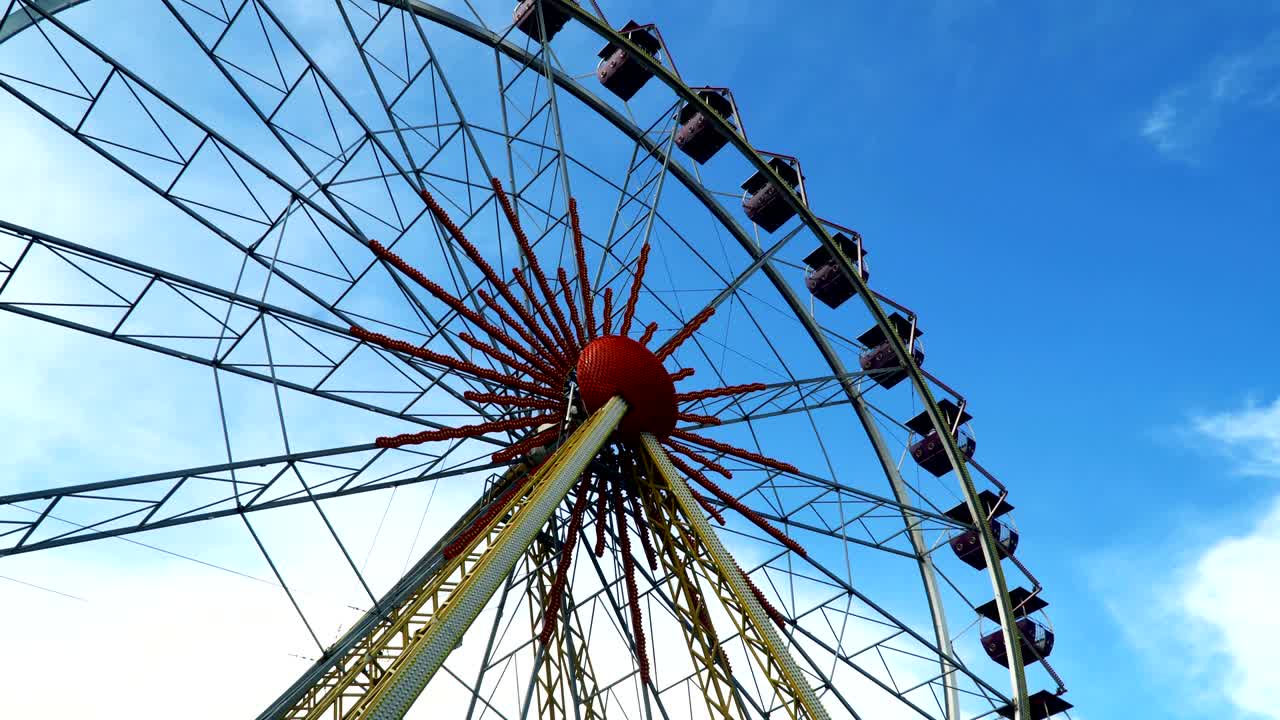 rueda gigante contra el cielo con nubes