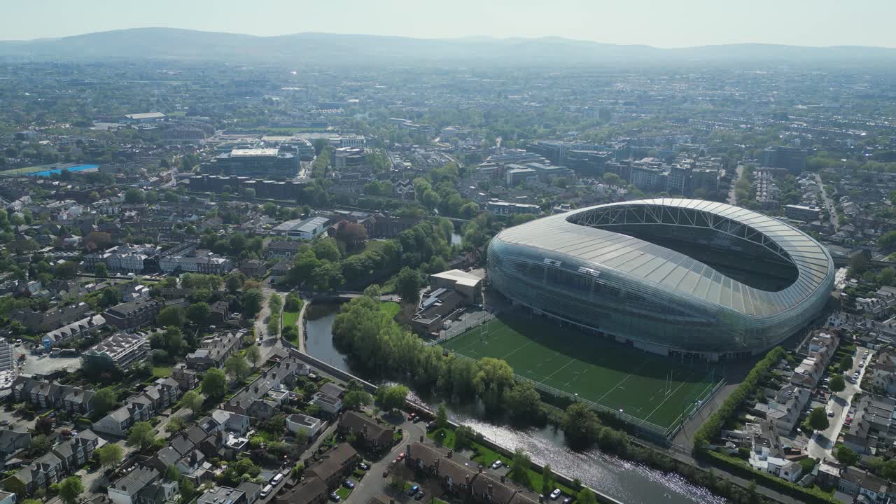 Dolly aerial view approaching Aviva Stadium and Meta Headquarters, Dublin, Ireland