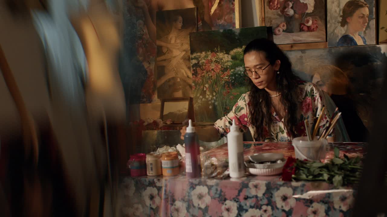 Artist in Studio Surrounded by Paintings