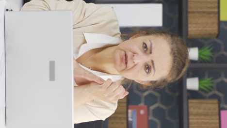 Vertical-video-of-Business-woman-looking-at-camera-receiving-bad-news.