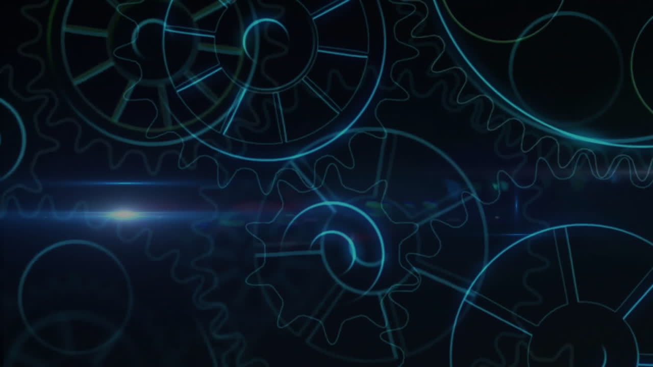 Animation of cogs moving over light spot on black background