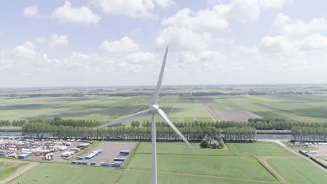 4k aerial drone shot going backwards of a windmill in the netherlands