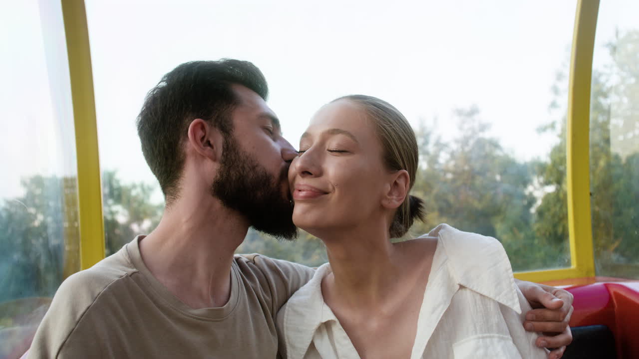 Man kissing her happy girlfriend