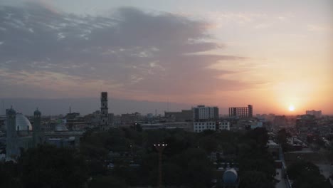 beautiful dawn wide view at the blue mosque with pan into the sunset over mazar-e-sharif, filmed before the taliban regained control of afghanistan in 2021.