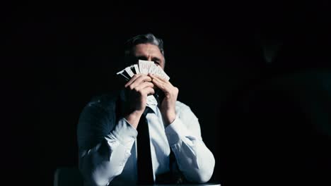 crooked cop counting and enjoying the smell of money, corrupt policeman, bribery