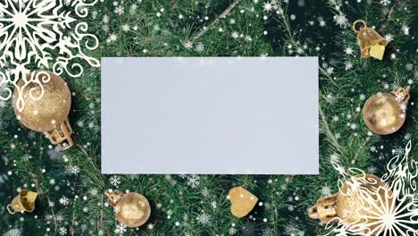 christmas background with fir branches, snowflakes and golden balls. top view with letter and copy space