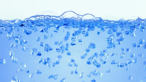 many bubbles in water close up, abstract water wave with bubbles in slow motion