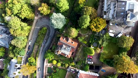 top down aerial view heidelberg germany residential community under walls of hilltop castle, drone shot