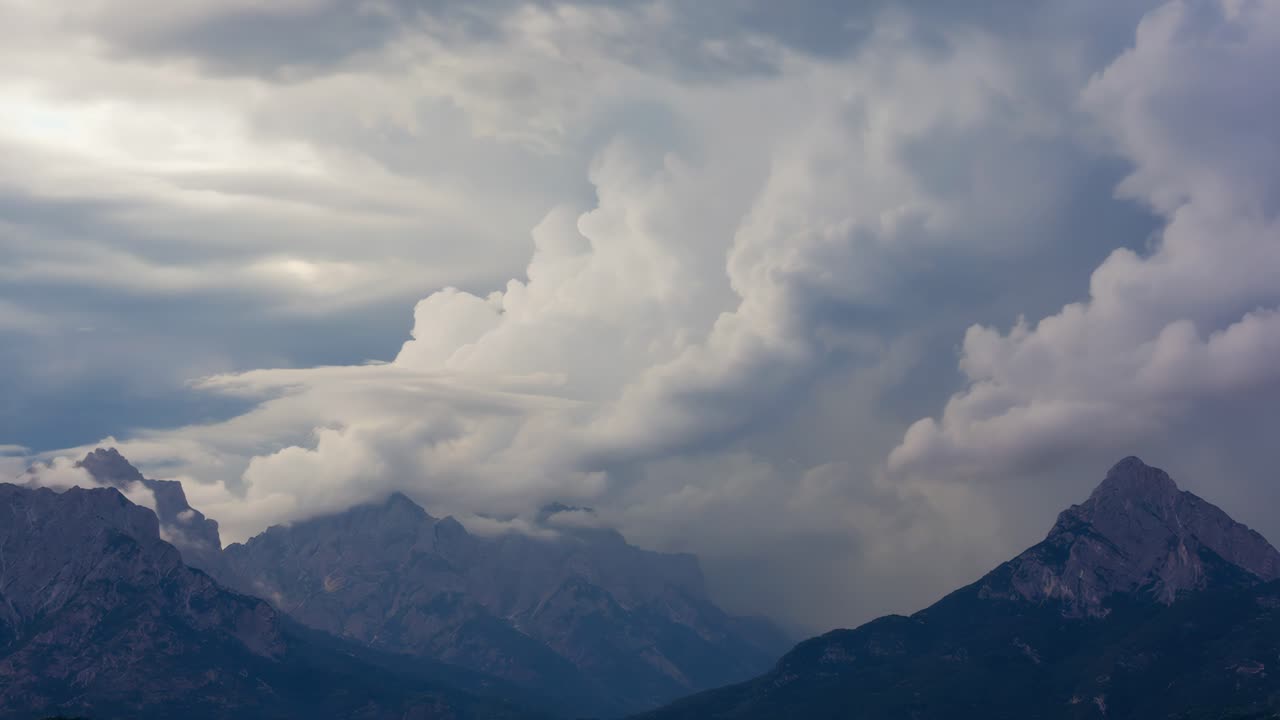 Mountain range under dramatic storm clouds