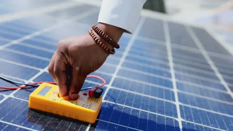 Technician,-hands-and-multimeter-testing-solar