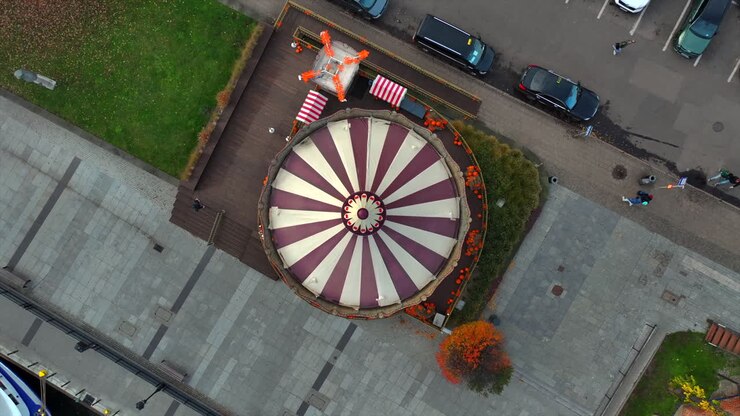 Drone shot of spinning carousel based in the old town of Gdansk