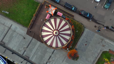 drone shot of spinning carousel based in the old town of gdansk