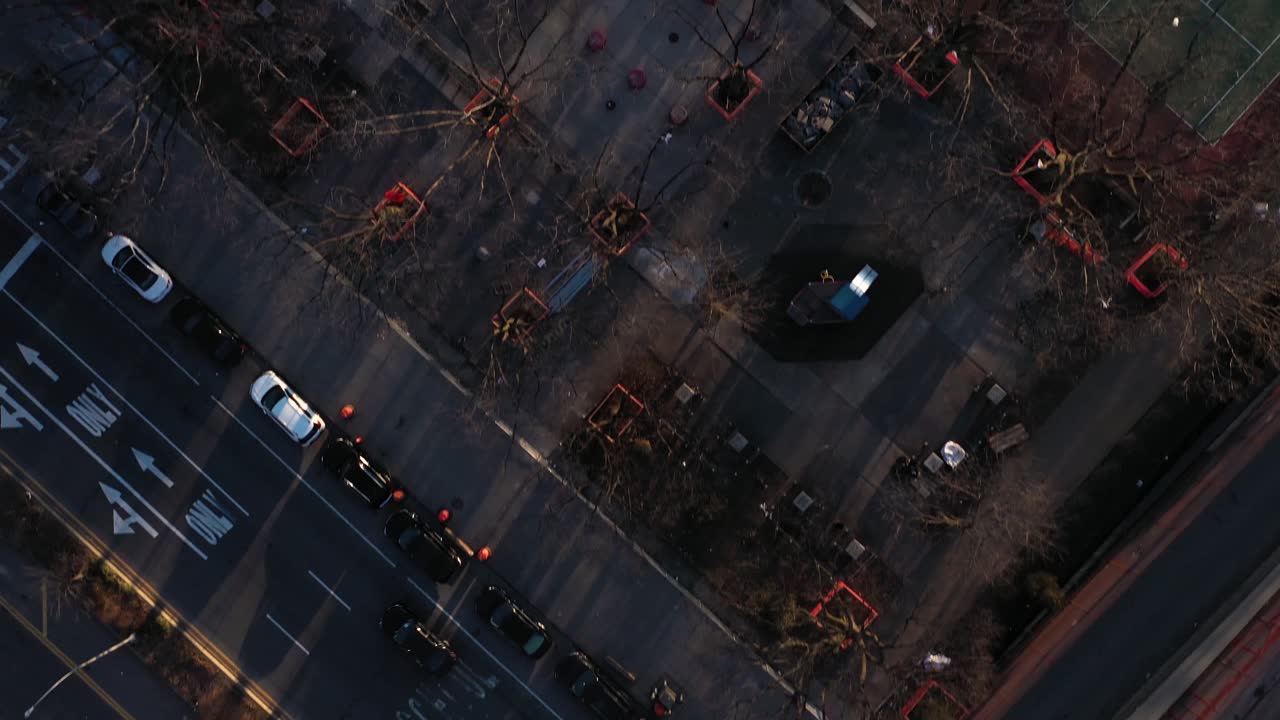 aerial downward facing flight over housing projects and tennis courts in the Harlem neighborhood of New York City
